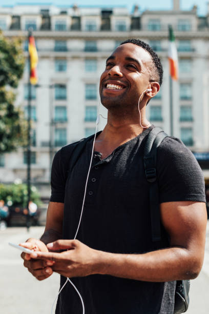 istock Handsome black guy in London, using mobile phone 922950672