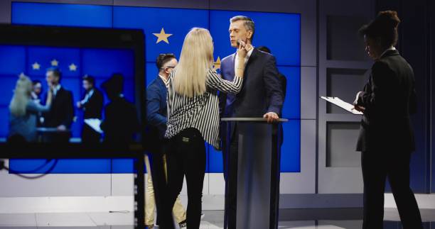 istock Makeup men preparing politician for announcement 922950720