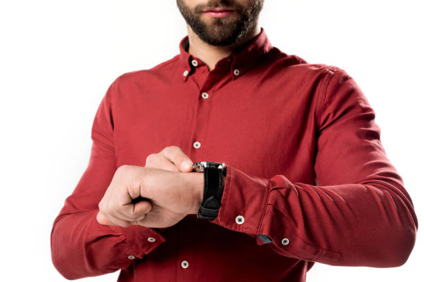 istock cropped shot of man checking time isolated on white 922950872