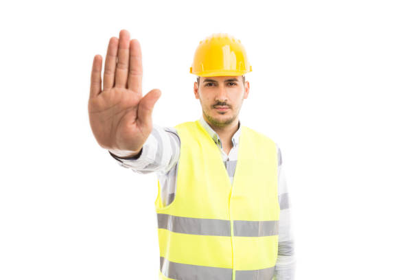 istock Engineer or architect showing palm as stop stay gesture sign 922950900