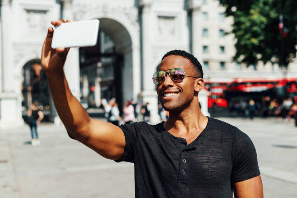 istock Handsome black guy, taking selfie for social media 922951016