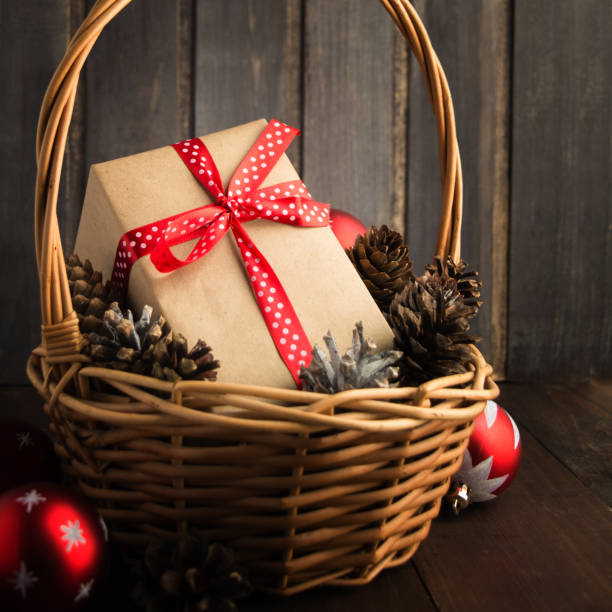 istock Christmas present in basket with cones and balls 922958460