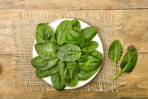 Fresh leaf spinach on background. Close