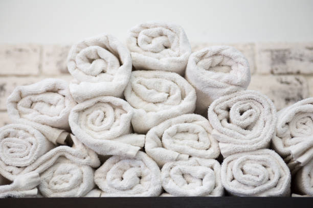 istock Rolled up white towels on a shelf. 922968296