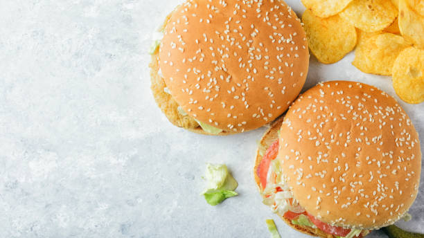 istock Chiken burgers on stone tray. 922973462