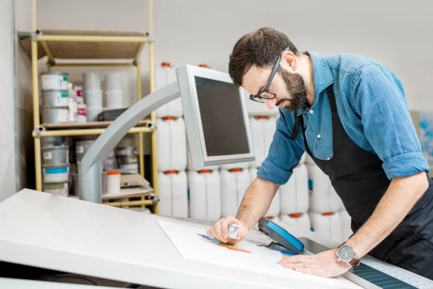 istock Checking the quality of the printing with magnifying glass 922973548