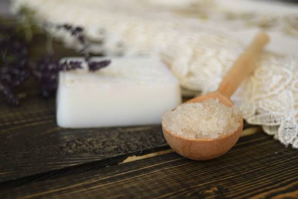 istock Salt and soap with herbs on wooden background 922973574