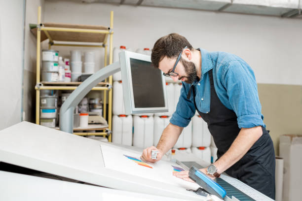 istock Checking the quality of the printing with magnifying glass 922973610