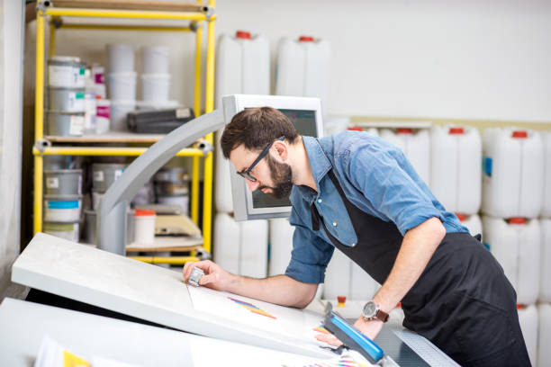 istock Checking the quality of the printing with magnifying glass 922973688