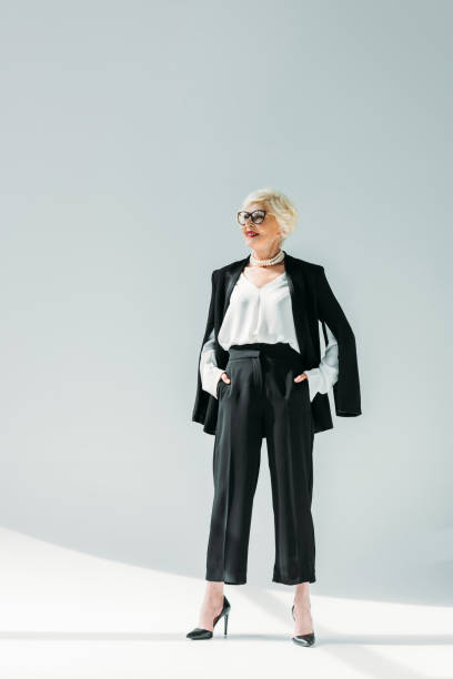 istock senior lady in black suit 922973874