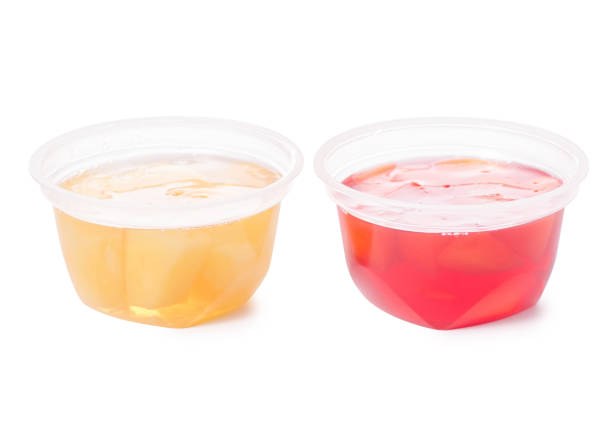 istock Cup of jelly with fruit red peach yellow pineapple isolation 922980226