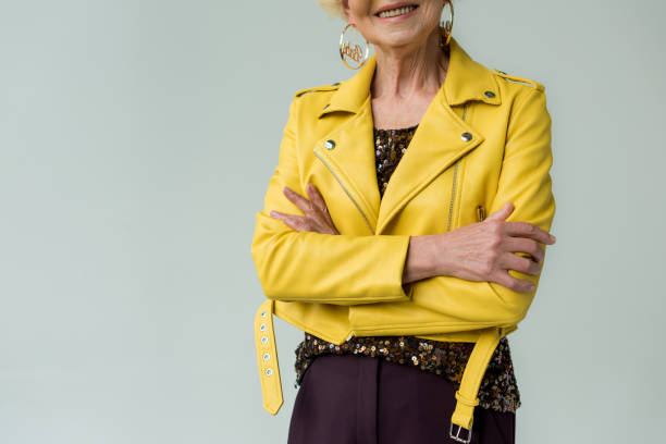 istock senior woman in yellow leather jacket 922981906