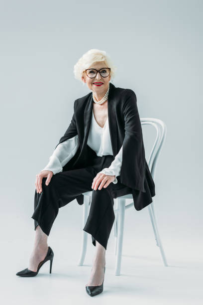 istock senior lady in black suit 922992492