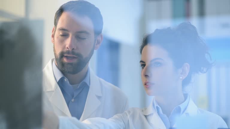 Doctors examining a patient's x-ray