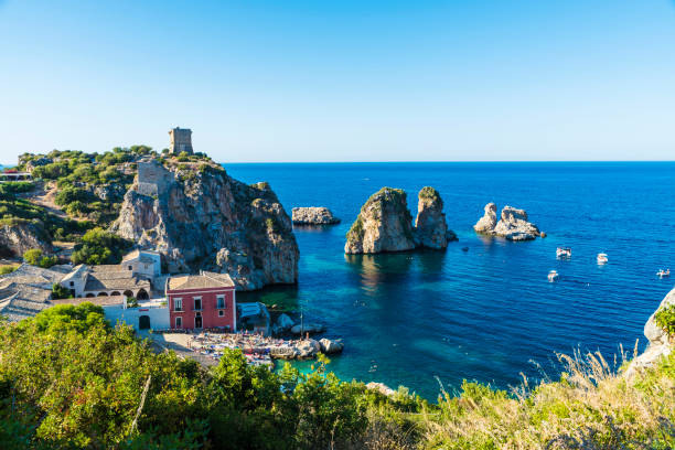 istock Cliffs on the coast in Scopello in Sicily, Italy 923007400