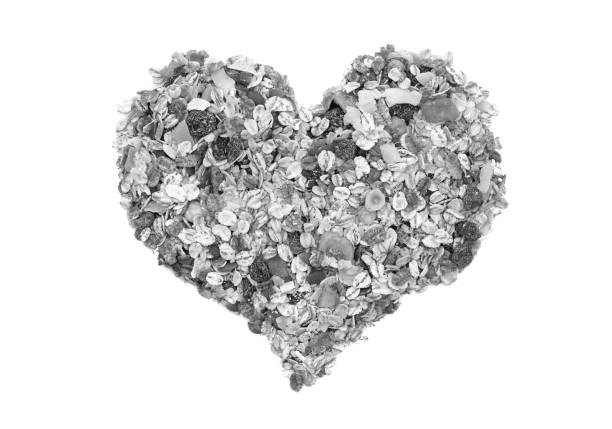 istock Muesli cereal grains, seeds, fruit and nut heart 923007572