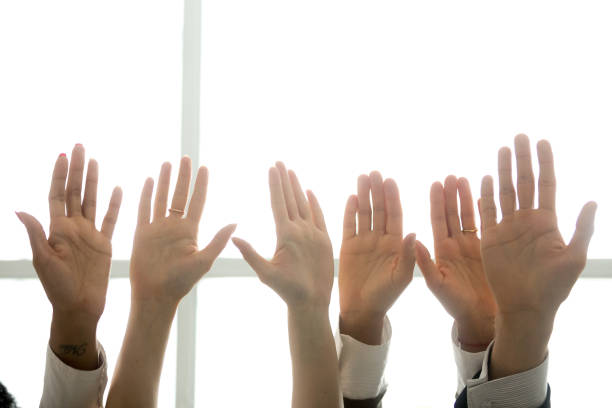 istock Black and white palms raised as volunteering, initiative and engagement concept 923018890