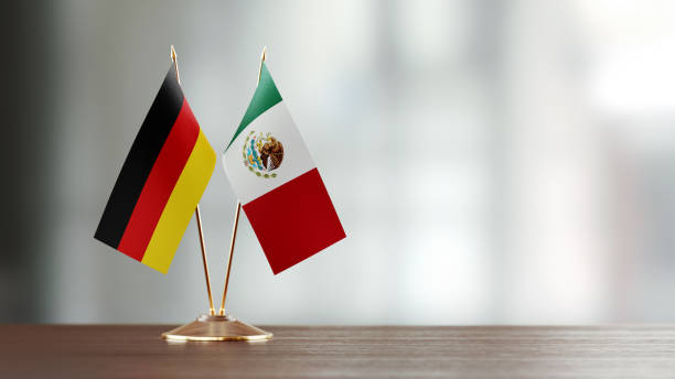istock German And Mexican Flag Pair On A Desk Over Defocused Background 923023922