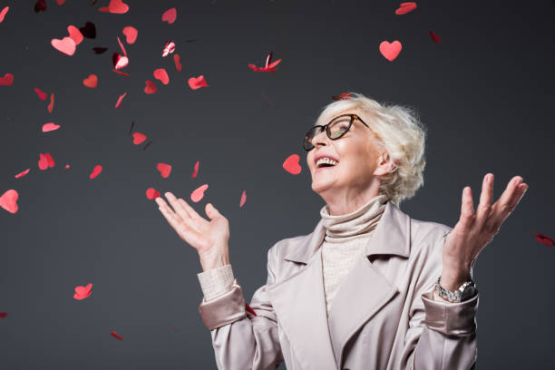 istock lady with heart shaped confetti 923024188