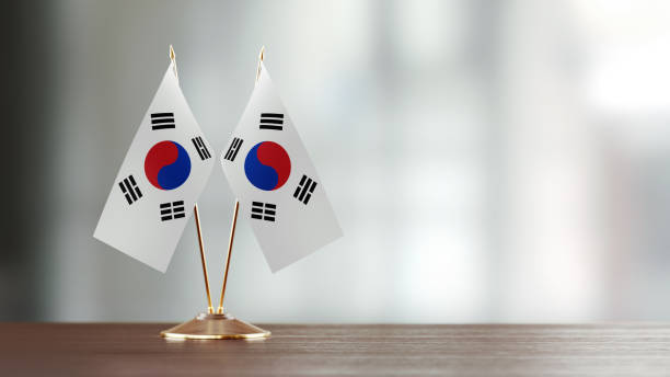 istock South Korean Flag Pair On A Desk Over Defocused Background 923027102