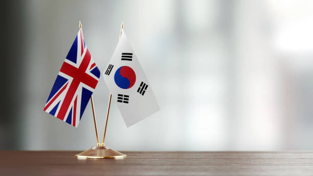 istock British And South Korean Flag Pair On A Desk Over Defocused Background 923031440