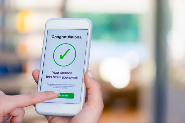 istock Mortgage Loan approval on mobile phone in a house. 923038902
