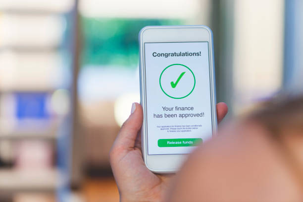 istock Mortgage Loan approval on mobile phone in a house. 923038906
