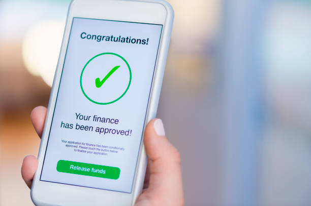 istock Mortgage Loan approval on mobile phone in a house. 923038910