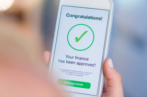 istock Mortgage Loan approval on mobile phone in a house. 923038914