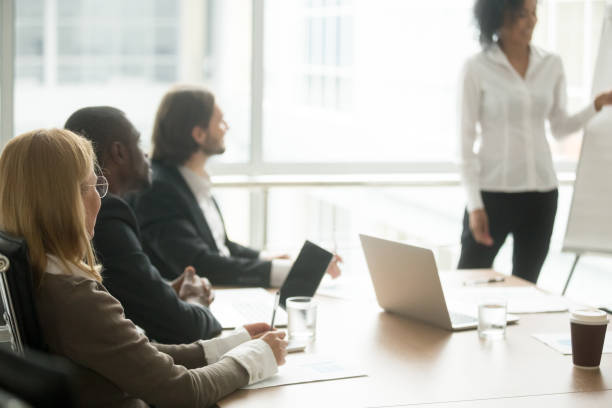 istock Multiracial businesspeople attending corporate group training or business presentation seminar 923039514