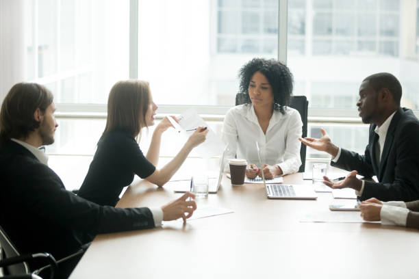 istock Diverse business partners arguing about bad contract at group meeting 923039620