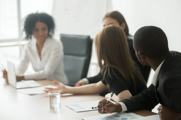 istock African and caucasian colleagues brainstorming sharing ideas sitting at conference table 923039674