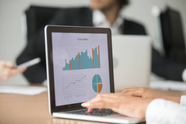 istock Businesswoman working with statistical report at team meeting analyzing data 923040308