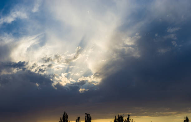 Landscape with dramatic light - beautiful golden sunset with saturated sky and clouds, peaceful nature serene background.