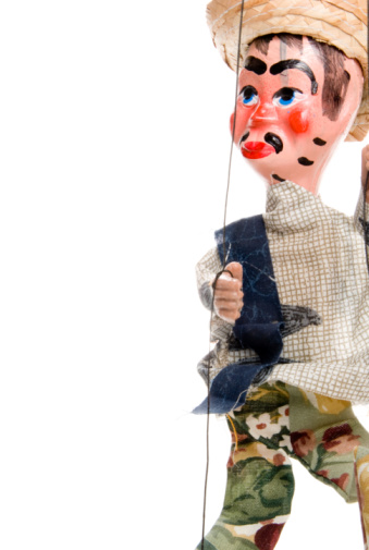A handmade custom Mexican style marionette puppet.