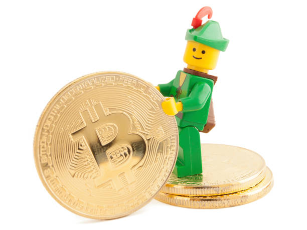 Robin Hood (as Lego figure) standing next to Bitcoin coins, January 07, 2018 in Venice, Italy stock photo