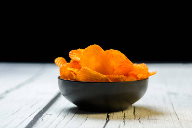 bowl of chips on dark background