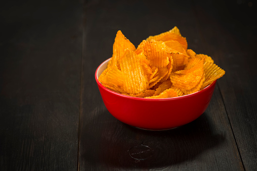 bowl of chips on dark background