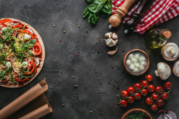 istock top view of uncooked pizza with ingredients on concrete table 923069314