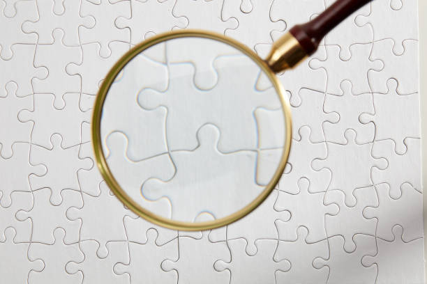 istock Looking for puzzle with magnifying glass 923072860