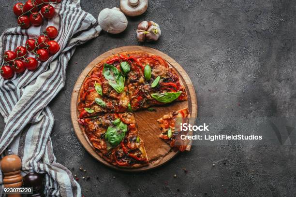 Top View Of Delicious Freshly Baked Pizza On Concrete Table Stock Photo - Download Image Now