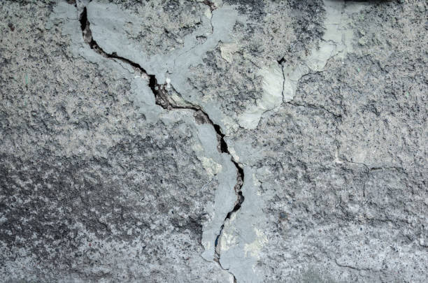 istock texture of gray decorative plaster with a large crack on the whole frame 923078198