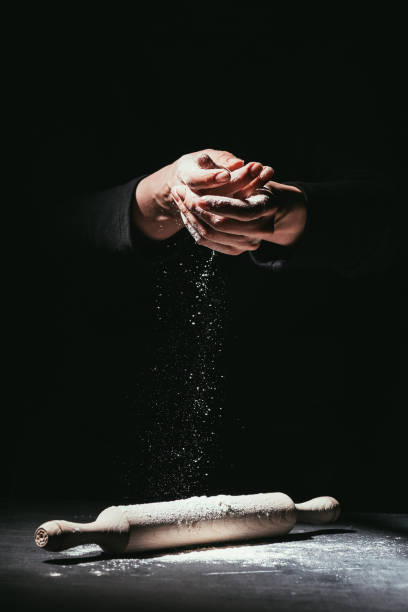 istock cropped shot of chef with hands covered in flour and rolling pin on table 923078564