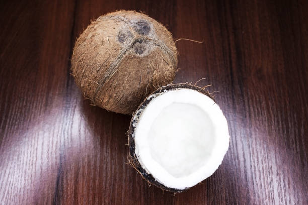 istock Coconut on a wooden background. 923079008