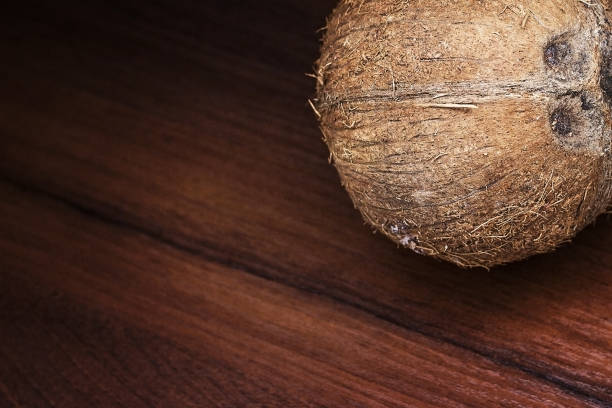 istock Coconut on a wooden background. 923079174
