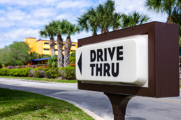 Drive Thru Taken outside the entrance to one of thousands of fast food outlets throughout the United States. drive through photos stock pictures, royalty-free photos & images