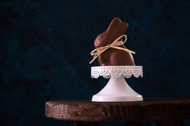 istock small chocolate bunny shot in the studio on dark blue background 923096758