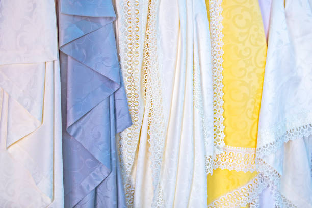 istock Waterproof silk tablecloths in the store. Openwork fine beautiful fabrics, textures 923099342