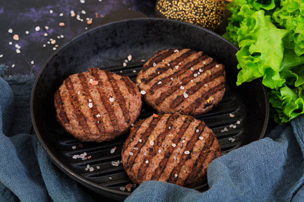 istock Ingredients for burger. Beef meat cooked on the grill 923099494