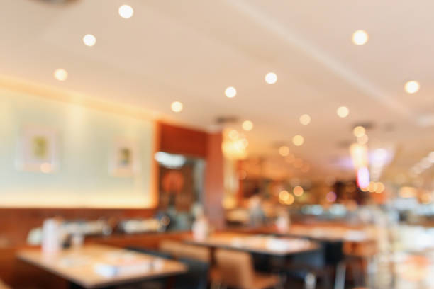 istock abstract blurred cafe restaurant with bokeh lights background 923099804